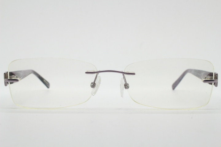 Givenchy rectangular frameless eye glasses made in Italy. Minimal optical frame with marbled brown arms. Prescription RX spectacles. Vintage