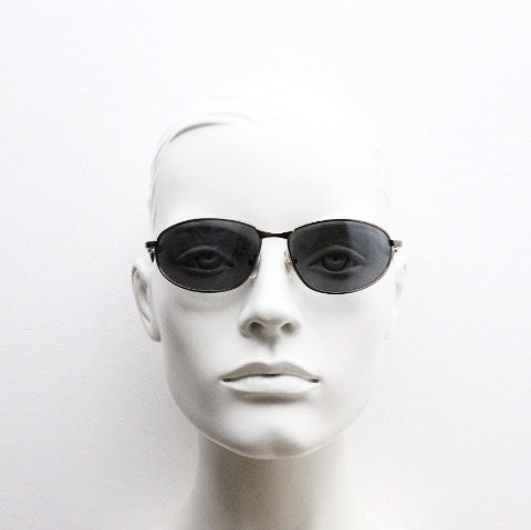Y2K vintage small bug eye sunglasses. Curved brown chrome metal frame with black arms. Unused 2000s NOS