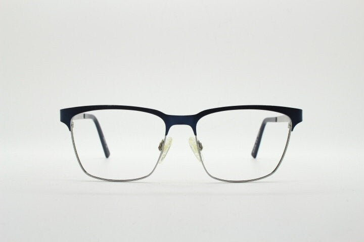 Karl Lagerfeld squared wayfarer shape eye glasses. Navy check pattern arms with satin finish brow optical frames. Prescription eyeglasses.