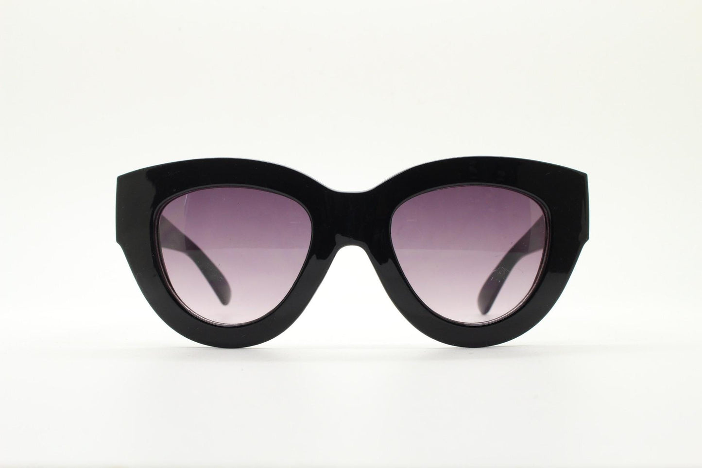 Y2K vintage thick oversized cateye sunglasses. Womens black gloss big arm cat eye frame with gradient lenses. 2000s NOS