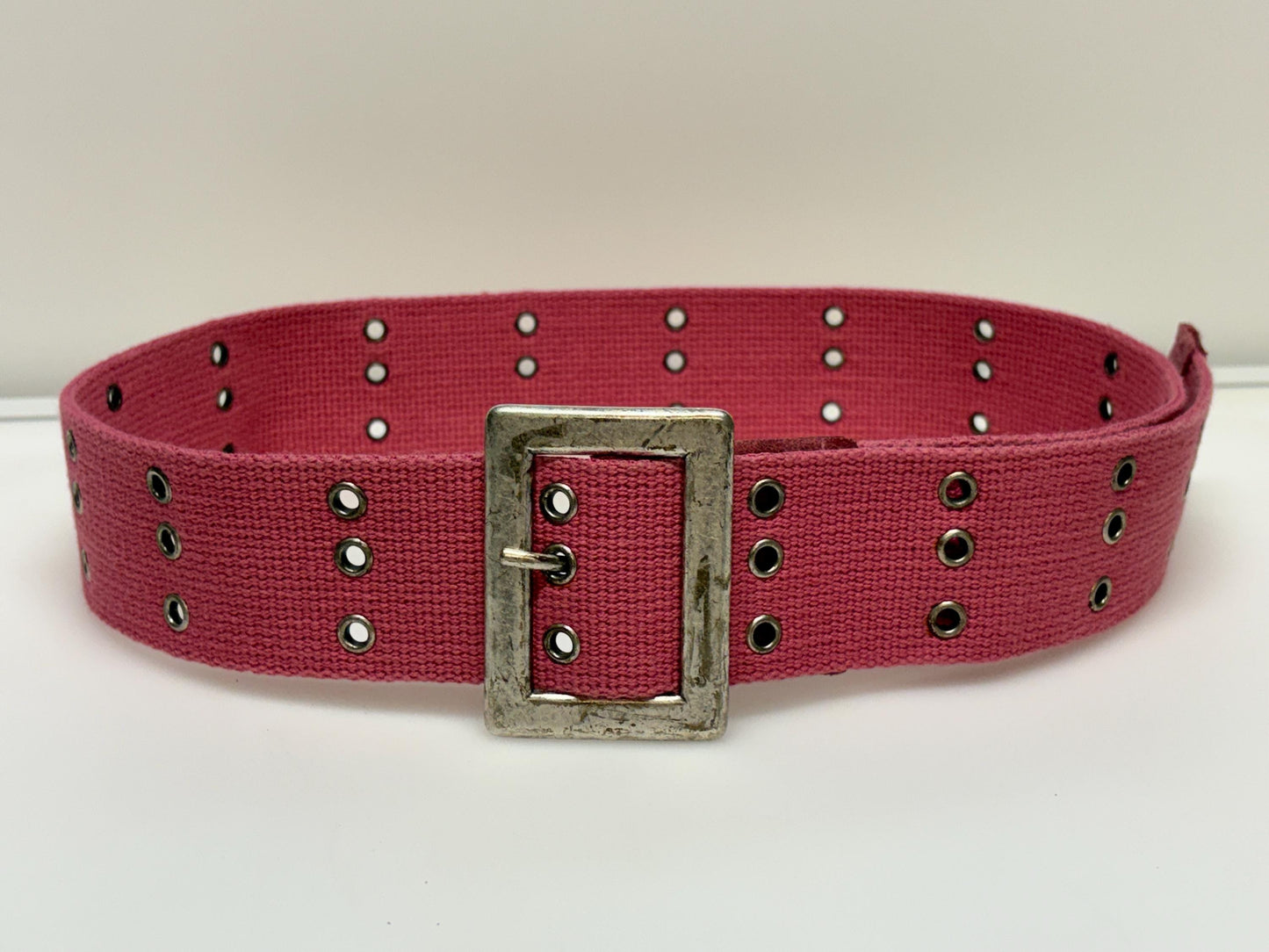 Y2k vintage thick candy pink army style belt with distressed metal buckle and 3 rows of lace holes. Statement feature / to cinch a dress