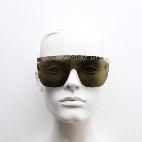 Khaleda and Fahad for Linda Farrow vintage oversized visor shield sunglasses made in Japan. Gold patterned brow line and brown monolens. NOS