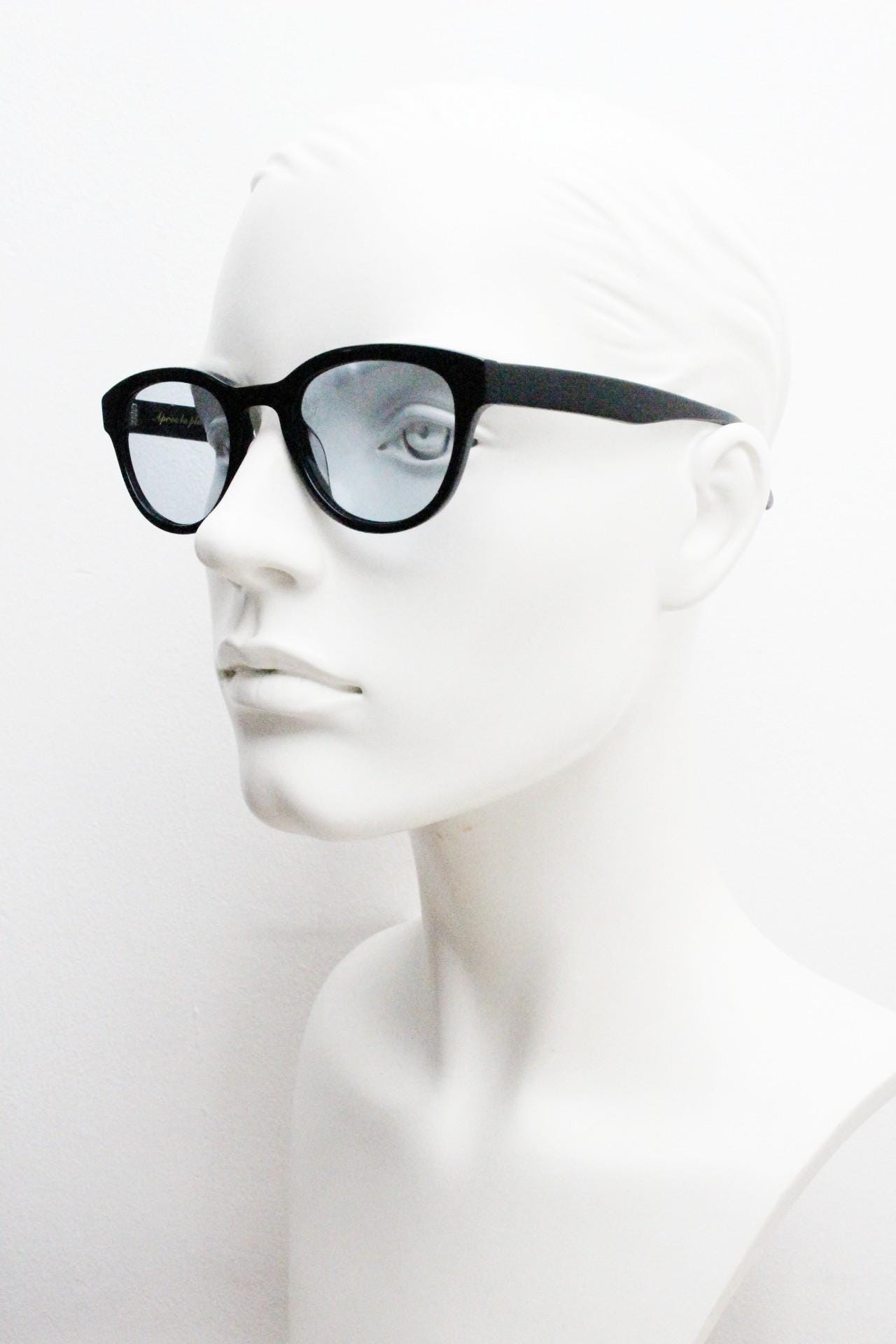 Vintage modified wayfarer design sunglasses. Black gloss acetate frame with extra light tone blue lenses in ideal proportions. NOS