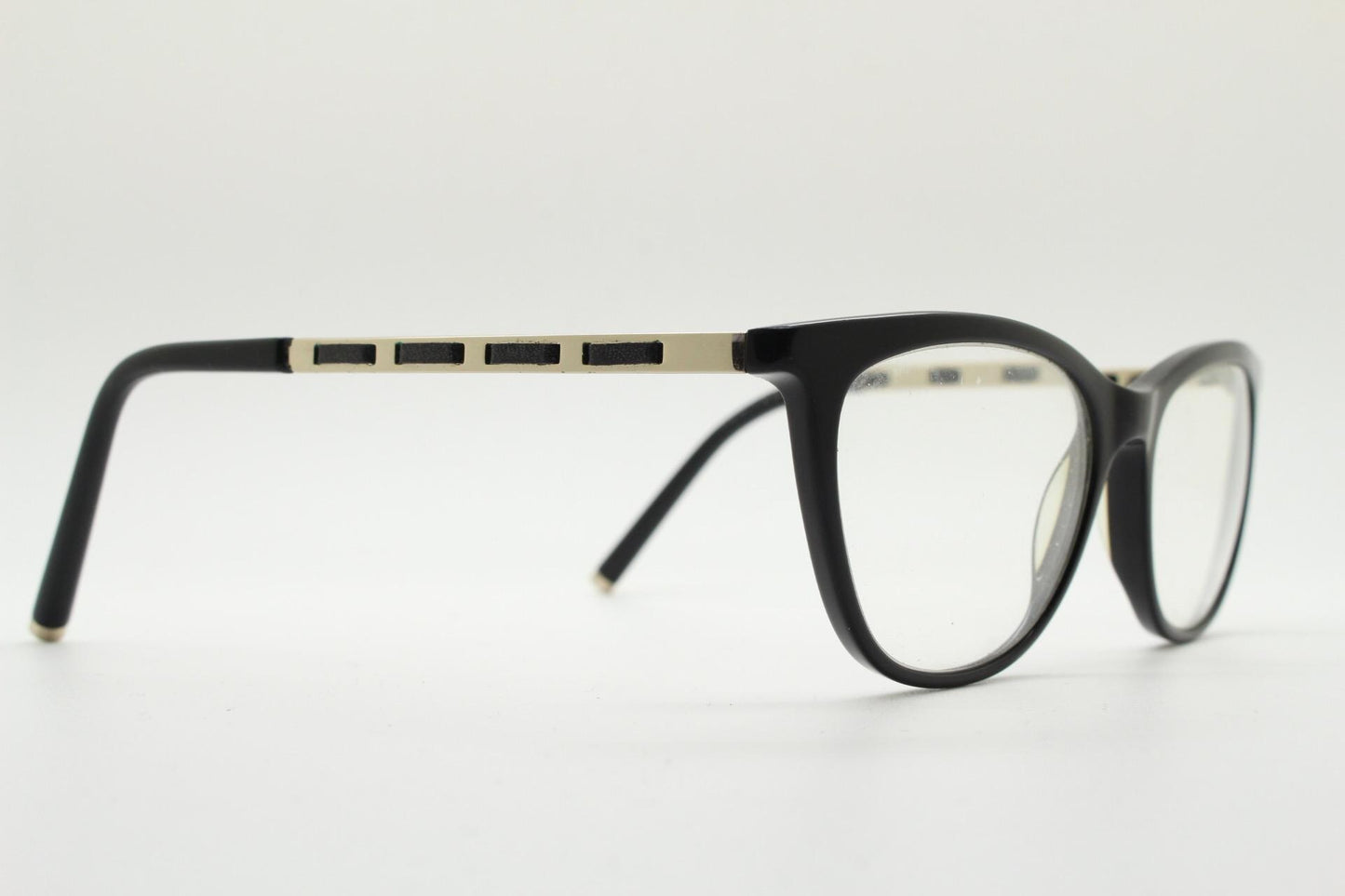 Vintage elegant cat eye glasses by Heritage. Black gloss acetate optical frames with leather lattice arms. Prescription RX cateye spectacles