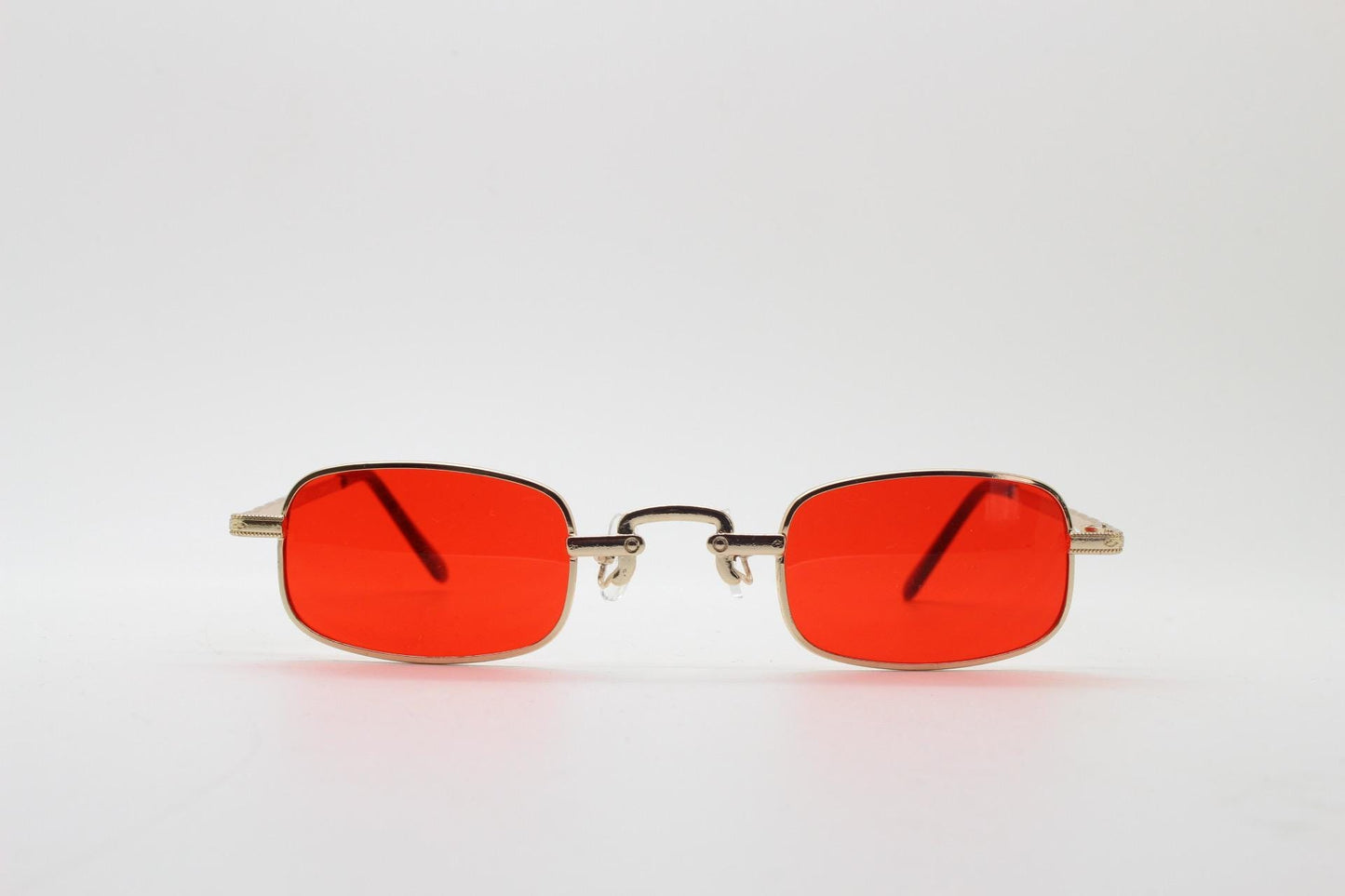 90s vintage small rectangular sunglasses. Imposing minimal gold metal victorian style frame with deep red lenses. Unused BNWT