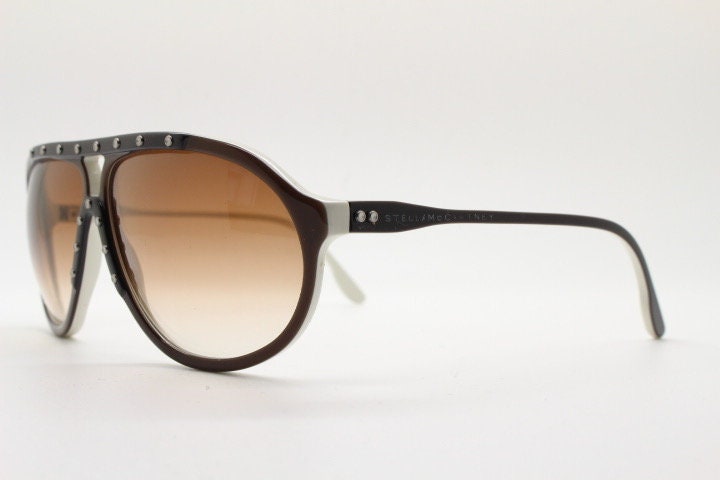 Stella Mc Cartney vintage aviator sunglasses. Small brown and white acetate aviators with graduating lens and white studs. Pilot. Teardrop