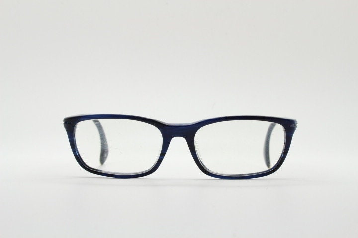 Calvin Klein rectangular low profile eye glasses. Dark navy blue gloss acetate optical frames. Prescription eyeglasses. RX