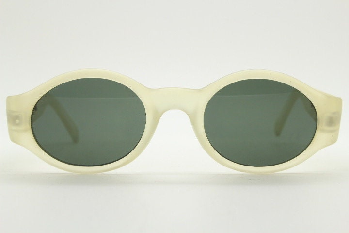 Vintage 90s oval transparent sunglasses. Frosted frame with dark green lenses and heart shaped chain link arms. Unworn NOS