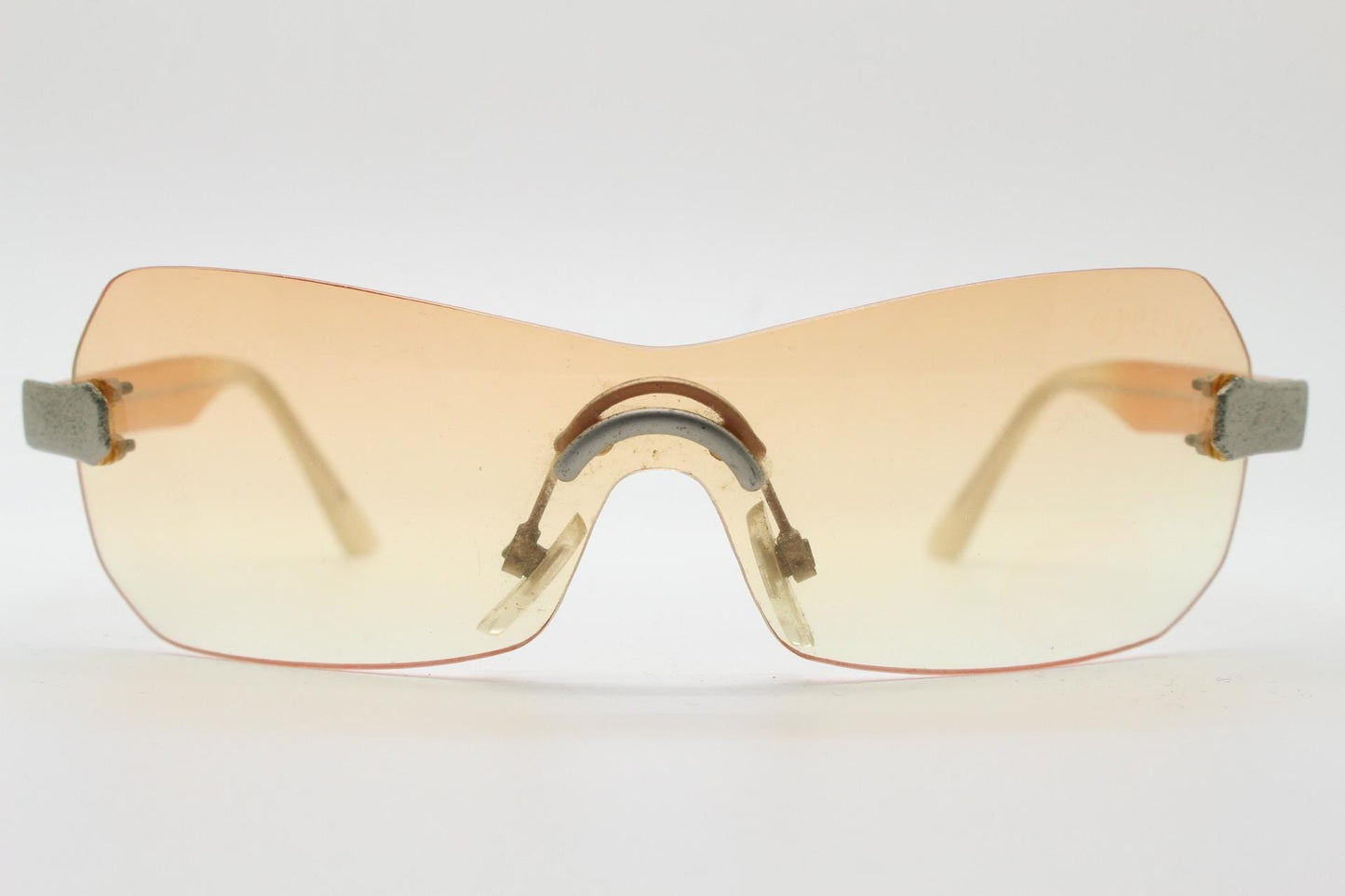 Y2K vintage frameless shield sunglasses. Dynamic 2000's light tone orange mono lens visor with matt silver trim. 00's Cosplay mini mask. NOS