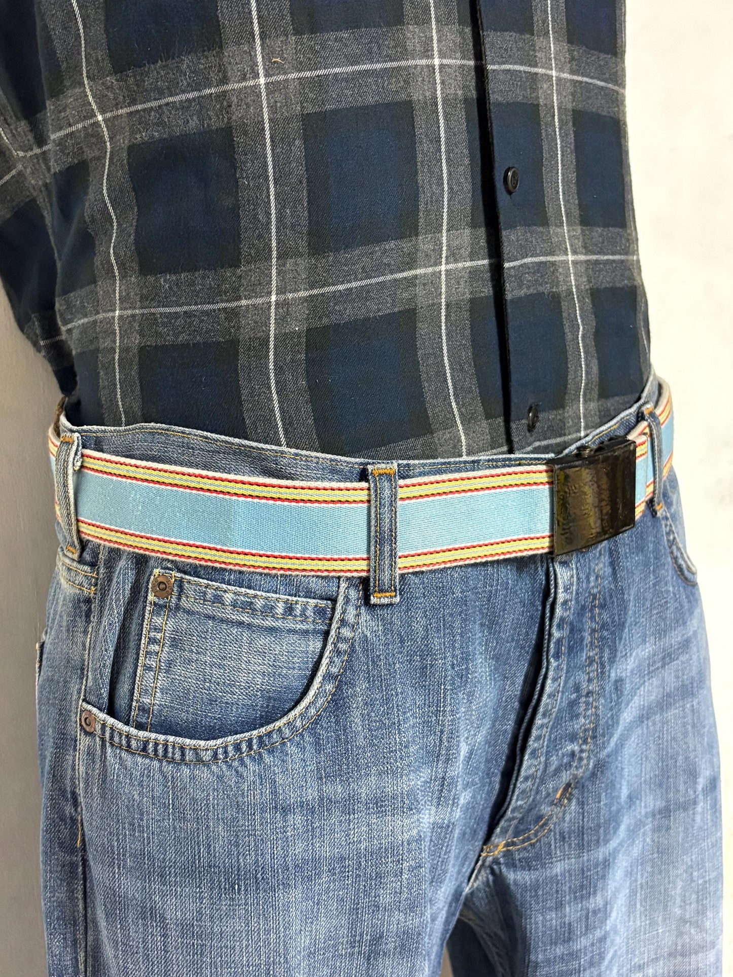 Y2K vintage 2' canvas army style belt in sky blue with red, white and yellow rainbow stripes. 2000s Mens large. Fully adjustable size range