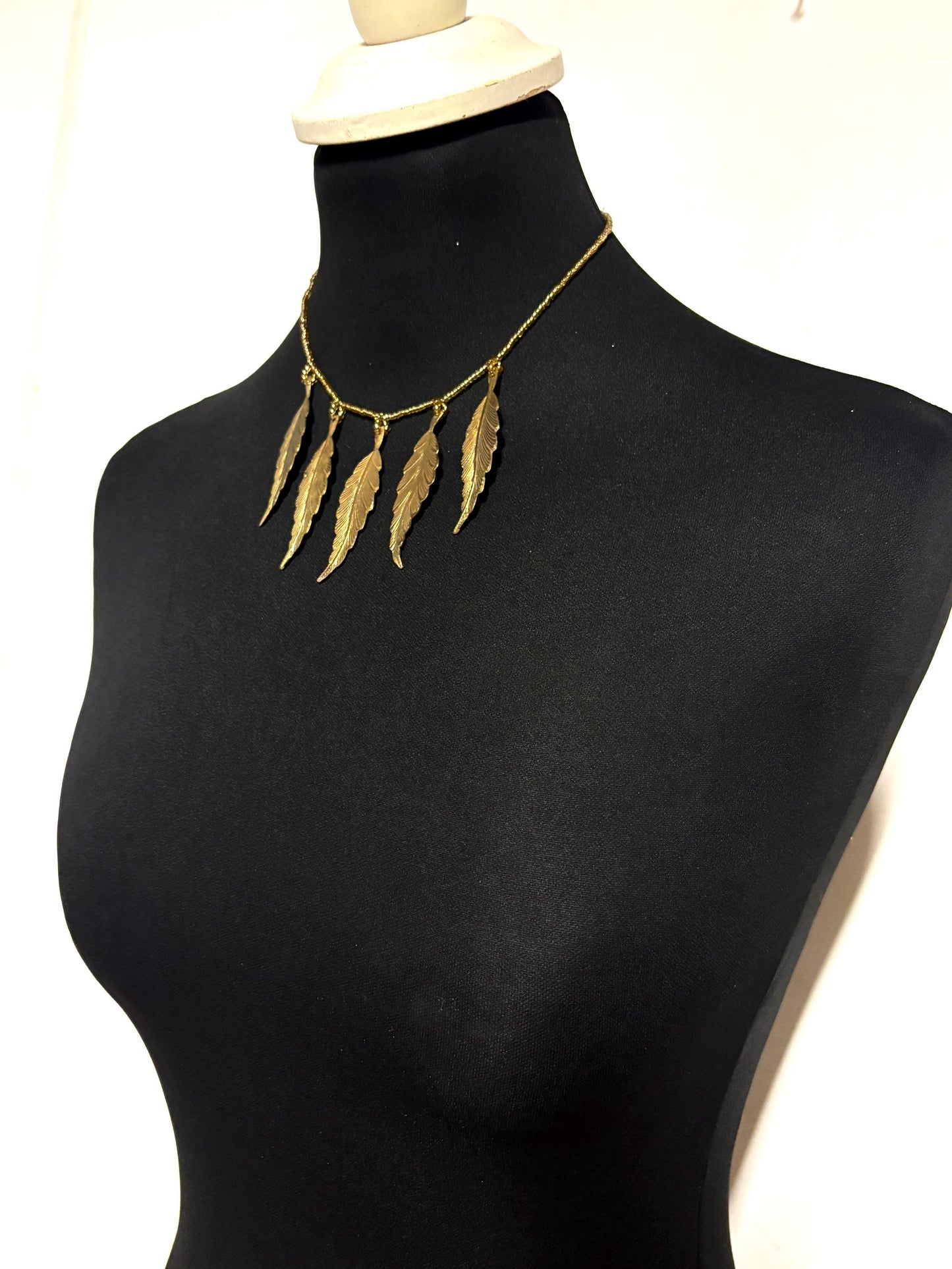 80s vintage gold beaded necklace with large dangling leaves . Charming statement piece. Country and western. Native american