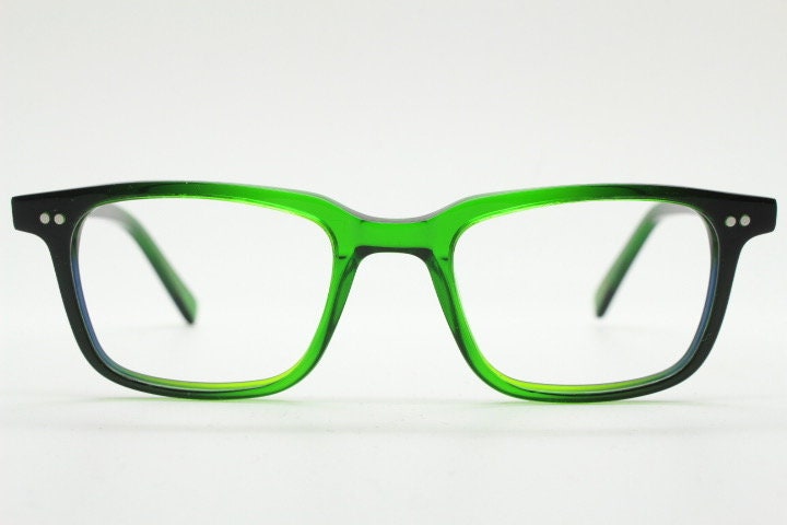 Green rectangular low profile wayfarer design eye glasses by found of Switzerland. Green gloss acetate optical frames. Prescription RX