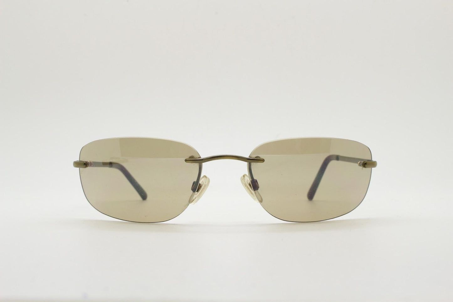 Ben Sherman 90s vintage frameless sunglasses. Minimal brown rectangular lens with brown chrome trim in neat proportions. Mens Mod shades