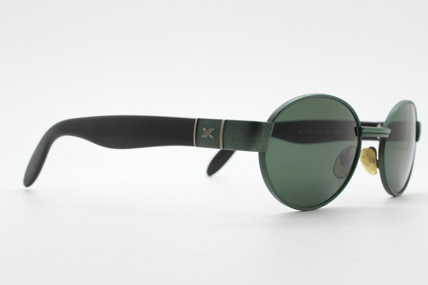 Safilo for Oxydo 90s vintage oval sunglasses made in Italy. Green matt finish solid metal frame with black arms and green lenses. Unused NOS