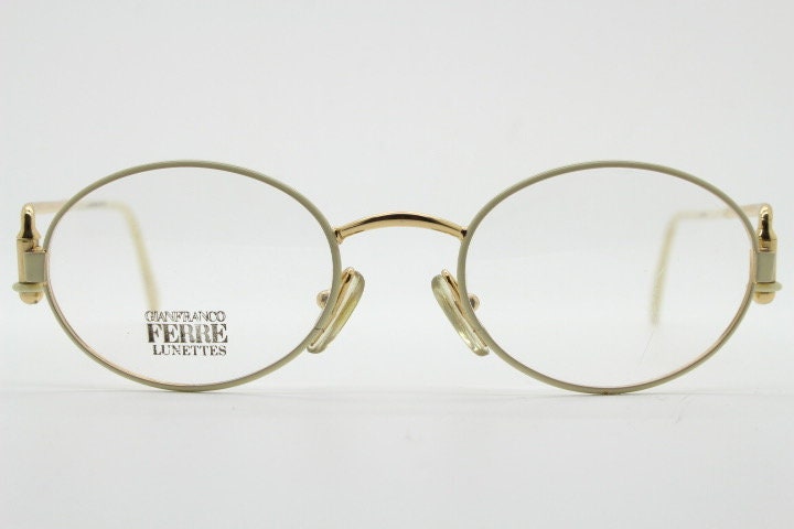 Gianfranco Ferre 90s vintage oval eye glasses made in Italy. White and gold metal tech design optical frame. Prescription RX spectacles. NOS