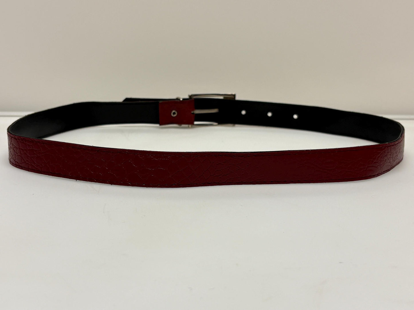 80s vintage womens embossed crocodile pattern 1" belt for jeans or trousers. Eco leather red vinyl with silver chrome buckle. Vegan