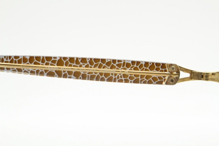 Silhouette 80s vintage oval eye glasses made in Austria. Transparent crystal optical frame with giraffe arm print. Prescription RX