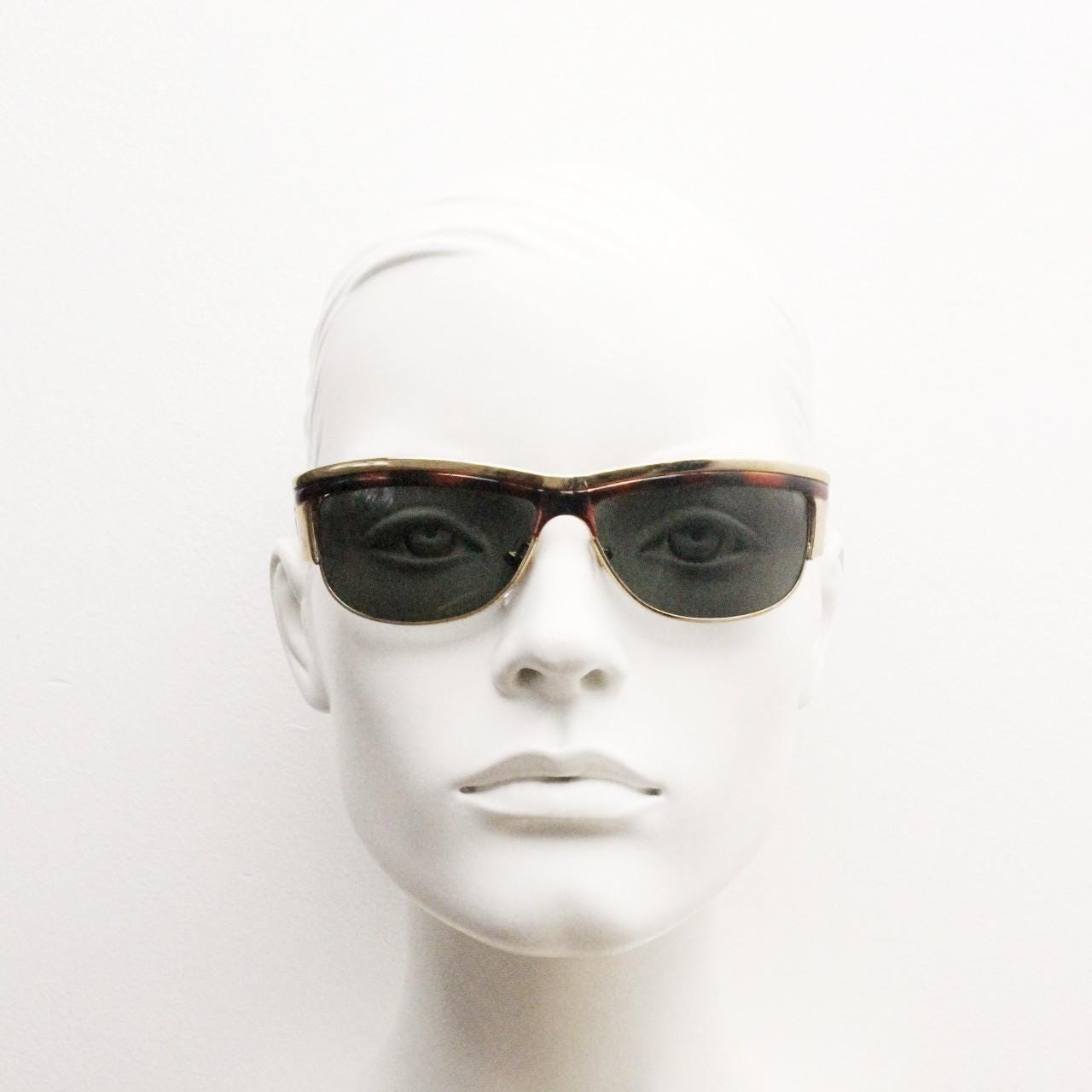 90s vintage visor shield sunglasses. Substantial metal curved wraparound frame with metallic tiger brow and abstract arm patterns. NOS. BNWT