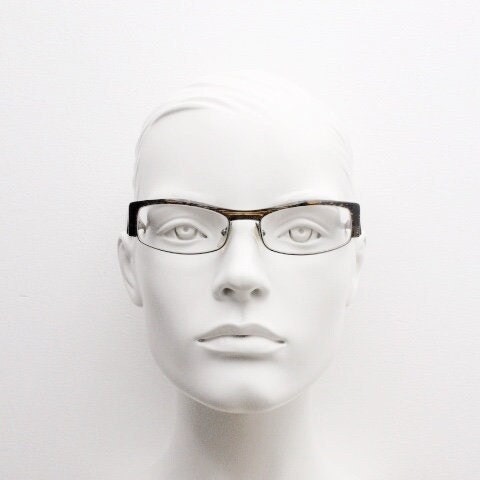 Alain Mikli 90s vintage eye glasses hand made in France. Low profile wrap around half frame in 'wood grain' acetate. Optical prescription RX