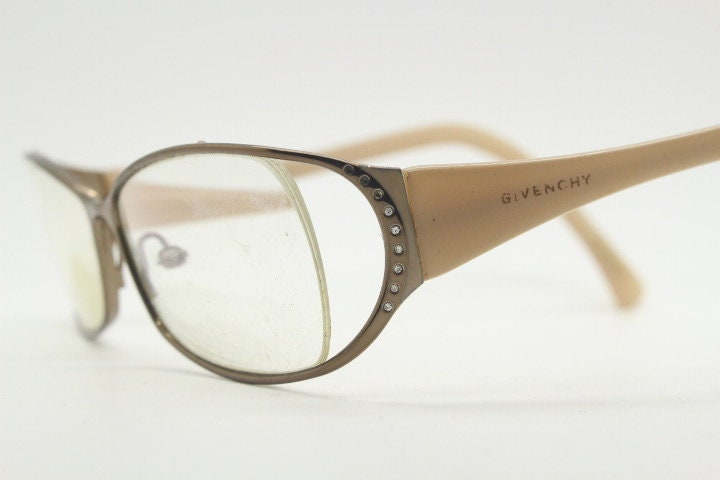 Givenchy eye glasses in brown chrome with beige acetate arms and gold diamante detail. Rhinestone optical frames. Prescription eyeglasses RX