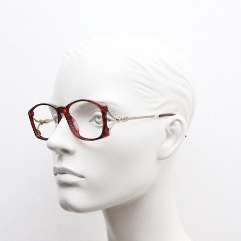 Christian Dior 80s vintage rectangular eye glasses made in Germany from Optyl. Striking marbled amber acetate optical frame. Prescription RX