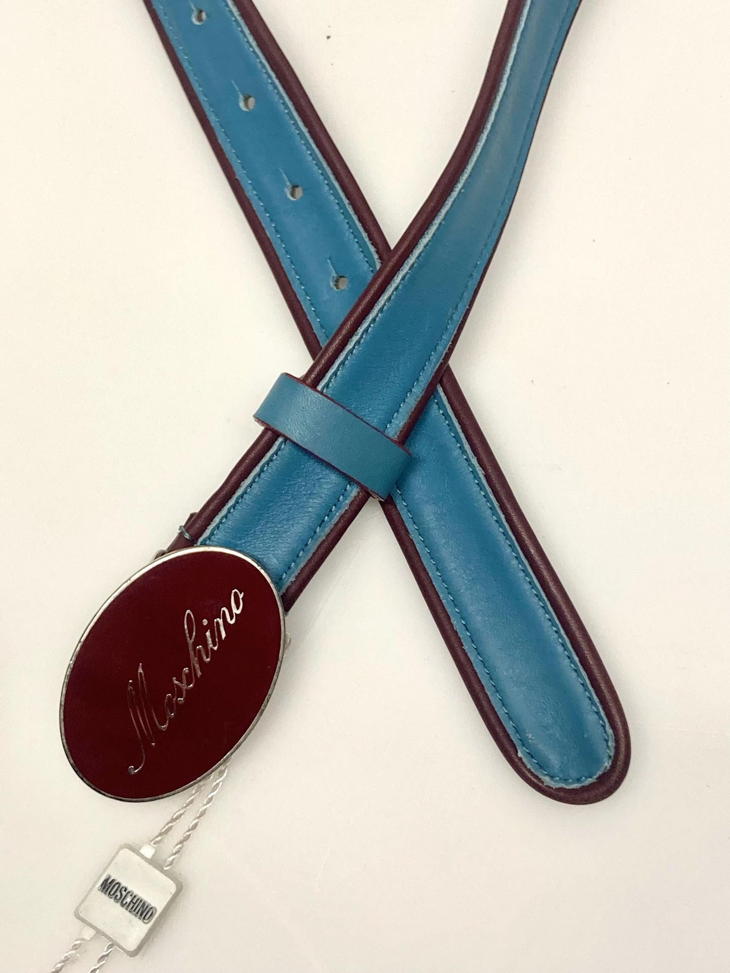 Moschino 90s vintage womens dress belt in oxblood and blue genuine leather with oval enamelled metal buckle. Made in Italy. BNWT. NOS