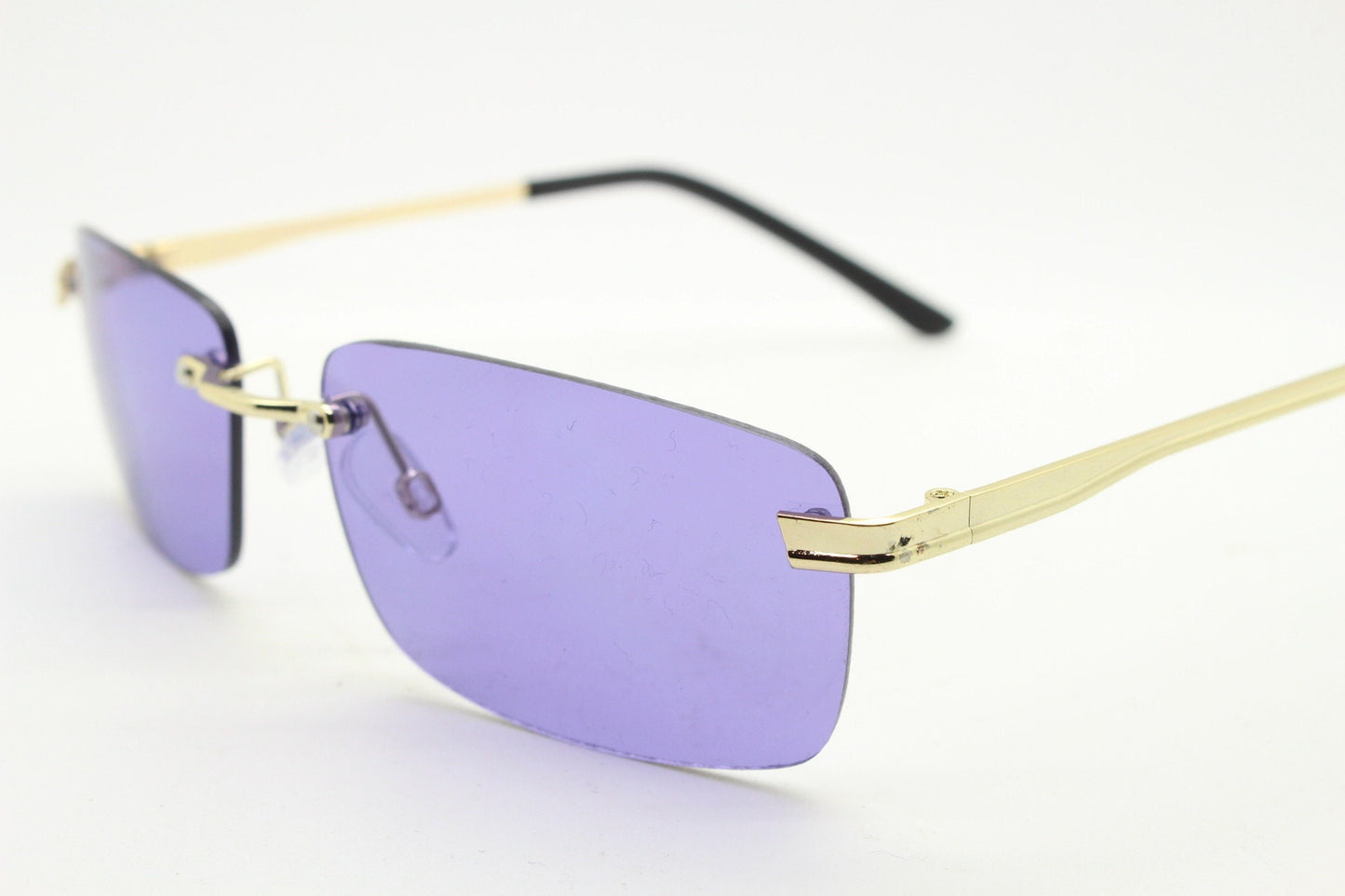 Y2K vintage frameless purple sunglasses. Rectangular lenses with gold bridge and arms. 2000s club kids. 00's. 90s Rave