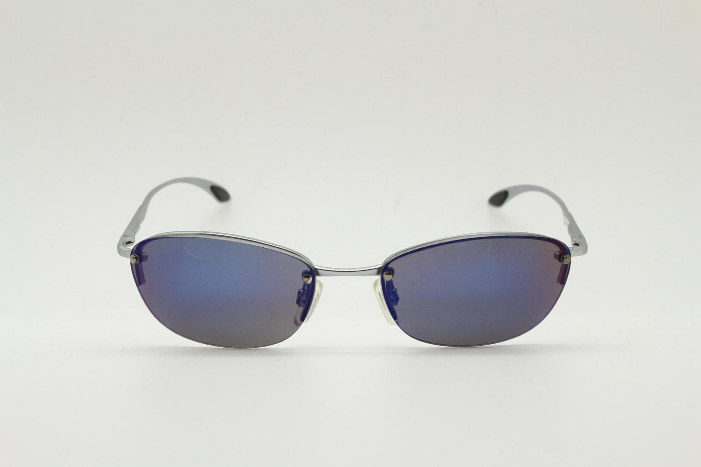 90s vintage small bug eye oval sunglasses. Minimal silver satin finish solid metal half frame with blue mirror lenses. Y2K.  NOS sample