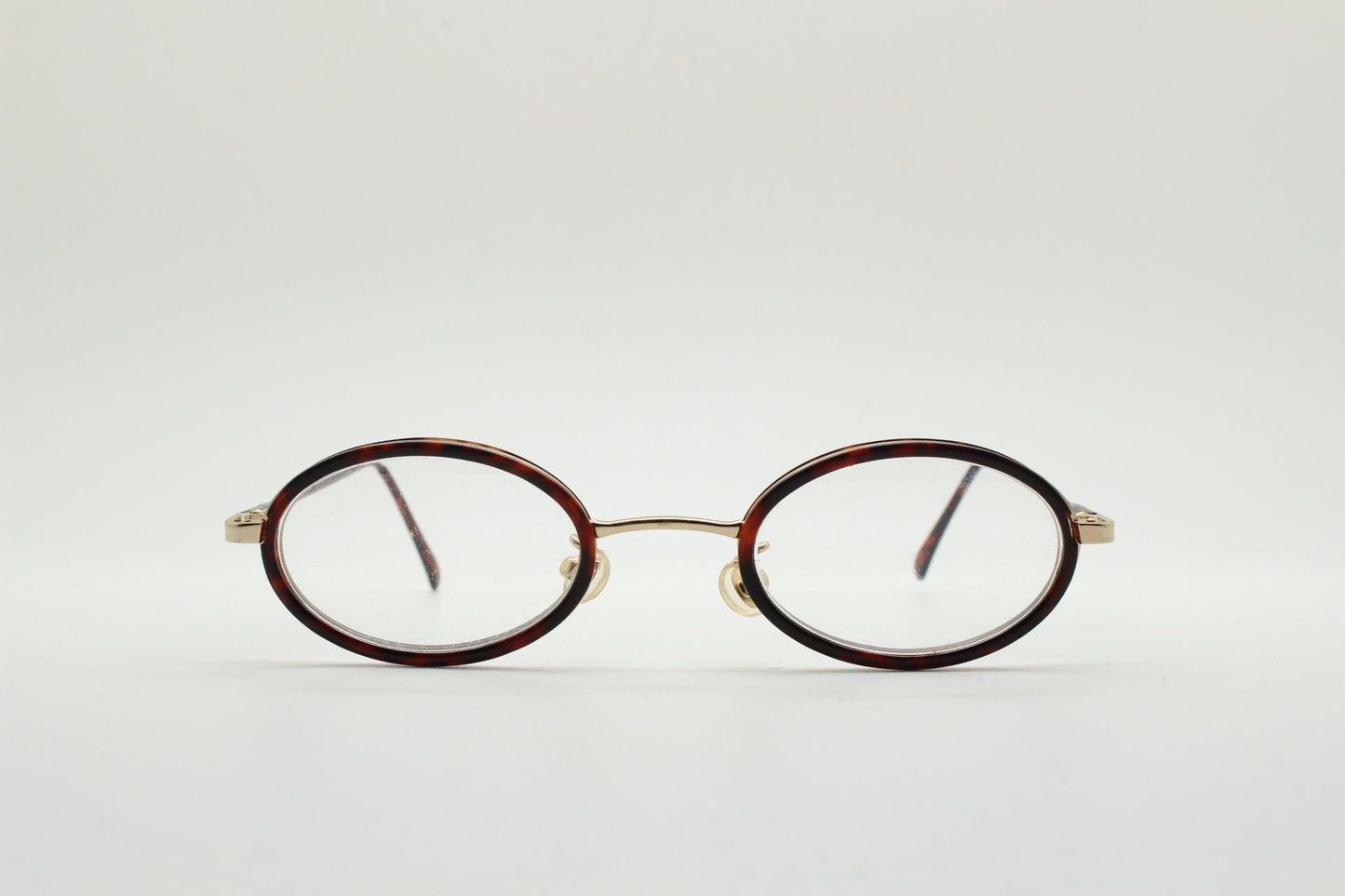 90s vintage small oval eye glasses. Gold metal frame 20s design optical frames with tortoise inserts and arms. Prescription. Spectacles NOS