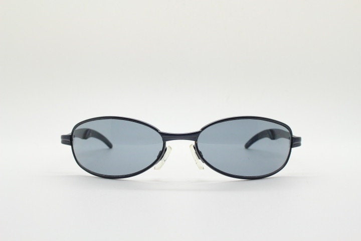 90s vintage oval small bug eye sunglasses. Curved grey satin finish solid metal frame. Rave. Steampunk. Unused NOS