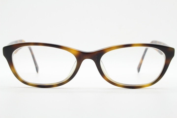 Calvin Klein Jeans modified cat eye glasses model CKJ918. Tortoise gloss low profile acetate optical frames. Prescription eyeglasses. RX