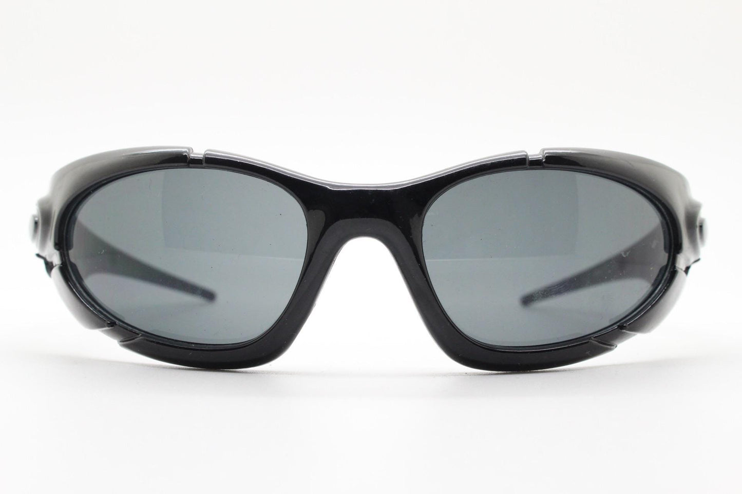 90s vintage sports shield sunglasses. All black gloss aerodynamic wraparound with many stylised features. 2000's. Hells angel uber fashion