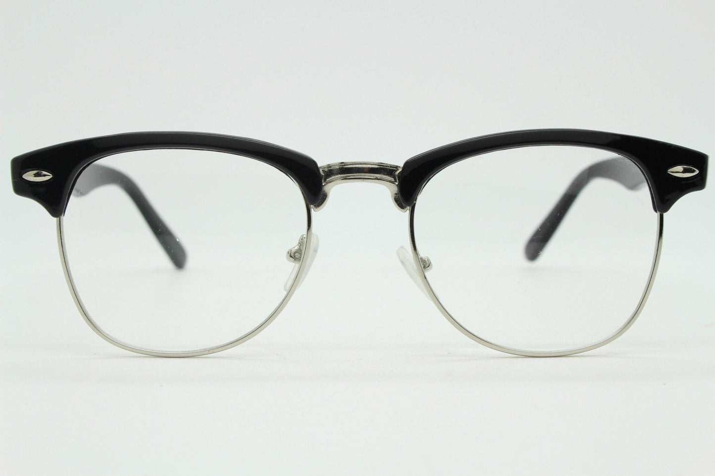 90s vintage black half frame eye glasses. Black gloss browline with silver wire rim frame and clear lenses. Classic 50s, 60s design. NOS