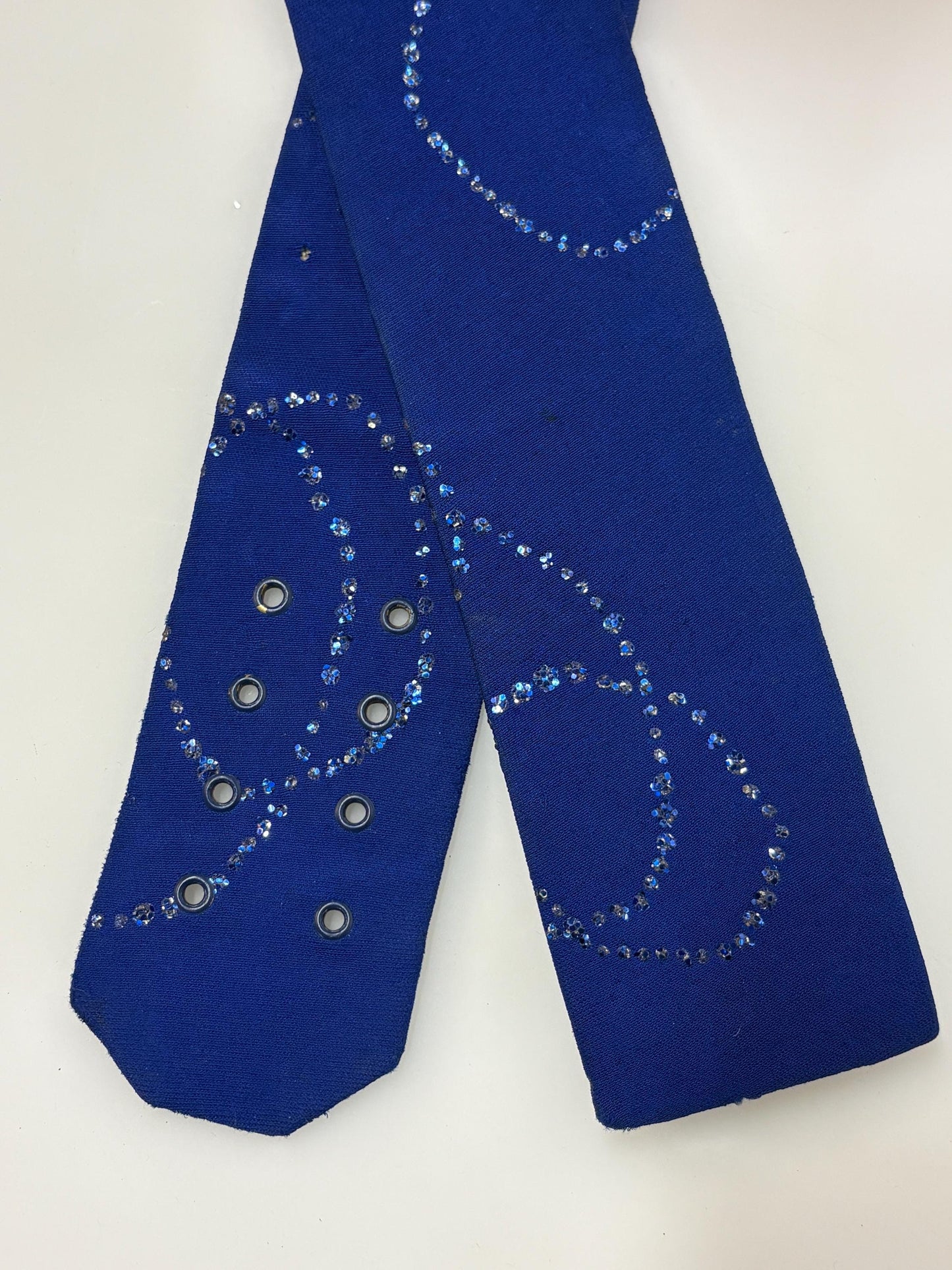 80s vintage womens hand made feature belt for a dress. Flattering V shape. Blue fabric with abstract glitter circles on a leather backing