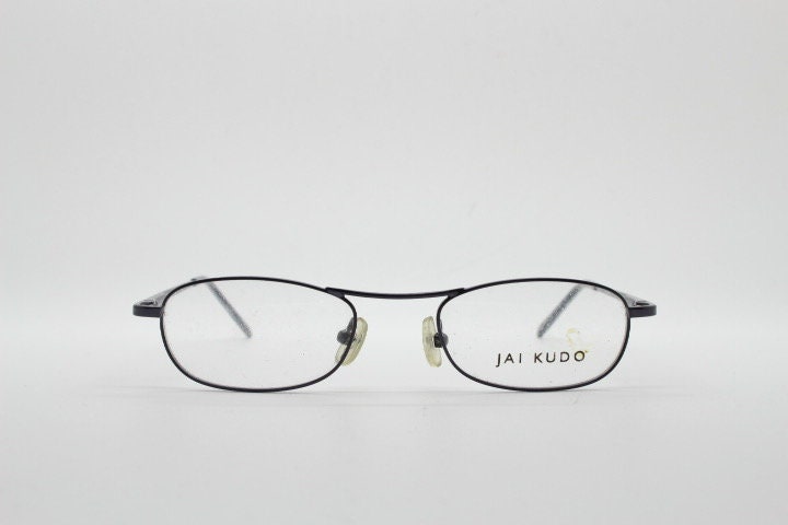 Jai Kudo 90s vintage oval eye glasses. Small low profile optical frames in charcoal grey chrome. Prescription eyeglasses. RX Spectacles
