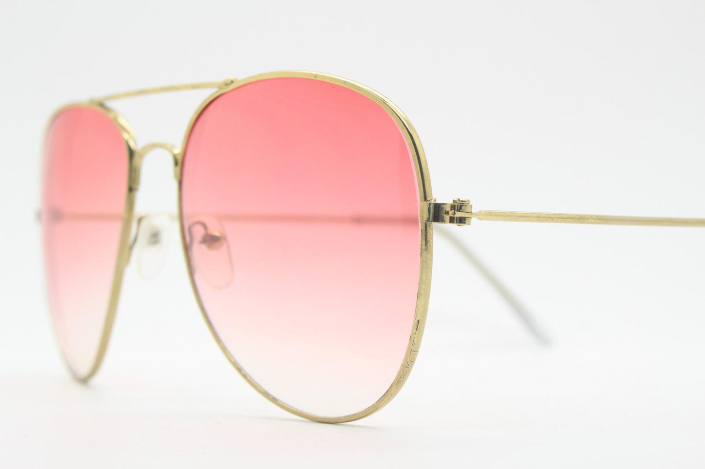Y2K vintage aviator sunglasses. Gold metal frame pilot aviators with atmospheric light pink gradient lenses. Teardrop. 70s. 2000s. 00s NOS