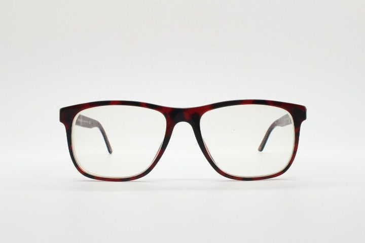 Versace modified wayfarer design eye glasses made in Italy. Mottled brown acetate optical frames with subtle logo. Prescription eyeglasses