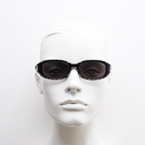 Burberry 90s vintage rectangular sunglasses model 8334/S made by Safilo. Low profile wrap around frame with subtle classic check pattern
