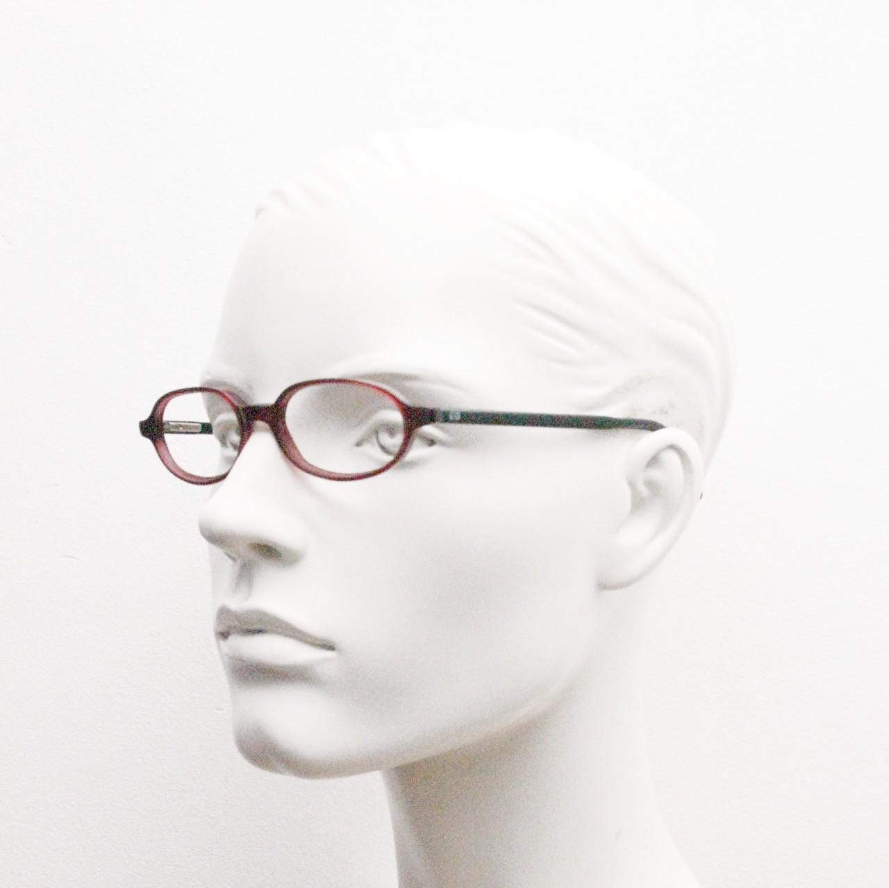 Diesel small oval eye glasses. Transparent brown front with black gloss arms. Acetate optical frames. Prescription 90s Vintage RX Spectacles