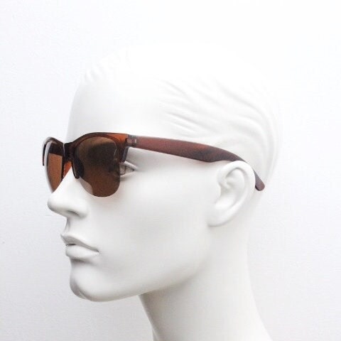 90s vintage modified wayfarer design sunglasses. Transparent brown browline half frame with brown or green interchangeable lenses . NOS