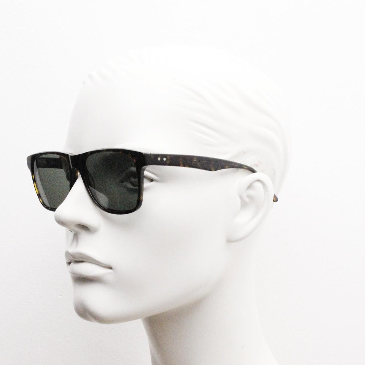 Bailey Nelson refined rectangular wayfarer sunglasses. All time classic vintage format. Hand made dark tortoise frame with green lenses