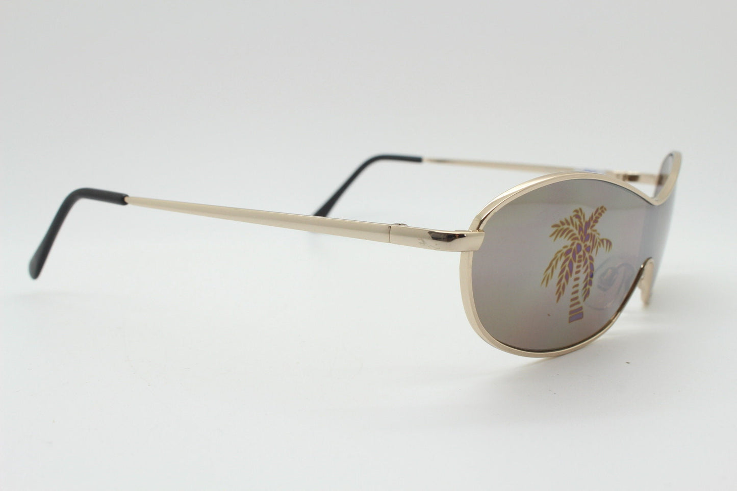 Party monster Y2K vintage visor sunglasses. Wraparound mono lens mini mask shield design with mind bending palm tree print. Unused NOS