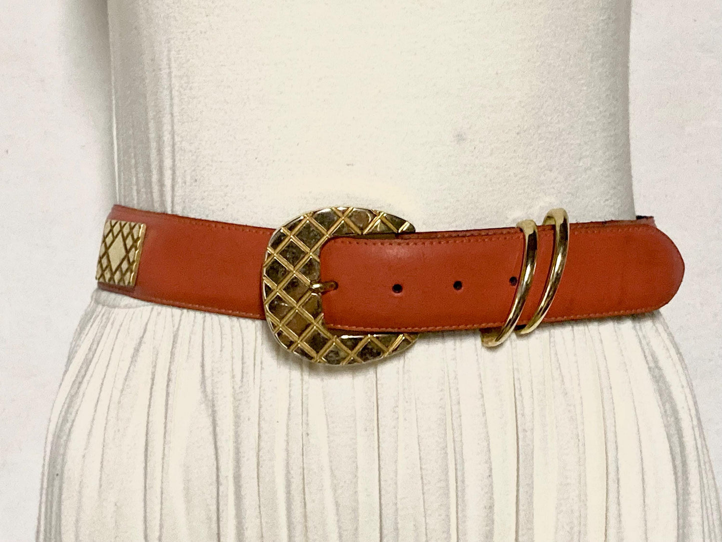 80s vintage womens dress / jeans belt in bright orange leather with golden metal squares. Made in France. Used in good condition