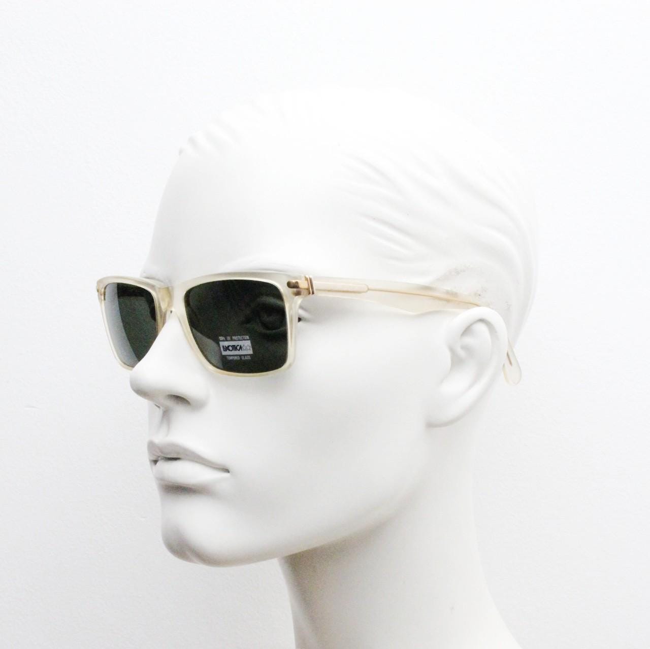 Luxottica 90s vintage rectangular sunglasses made in Italy. Transparent yellow acetate chunky frame with contrasting dark green lenses. BNWT