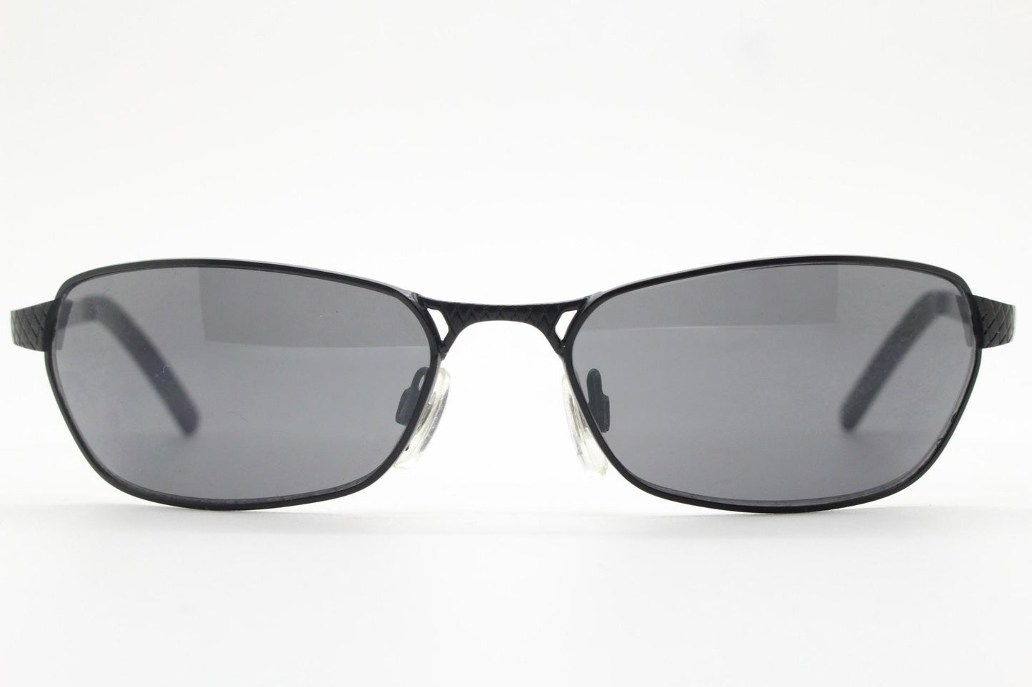90s vintage wraparound sunglasses. Black satin finish on rectangular frame with unassuming style details. 2000's. Y2K. Unused NOS bug eye