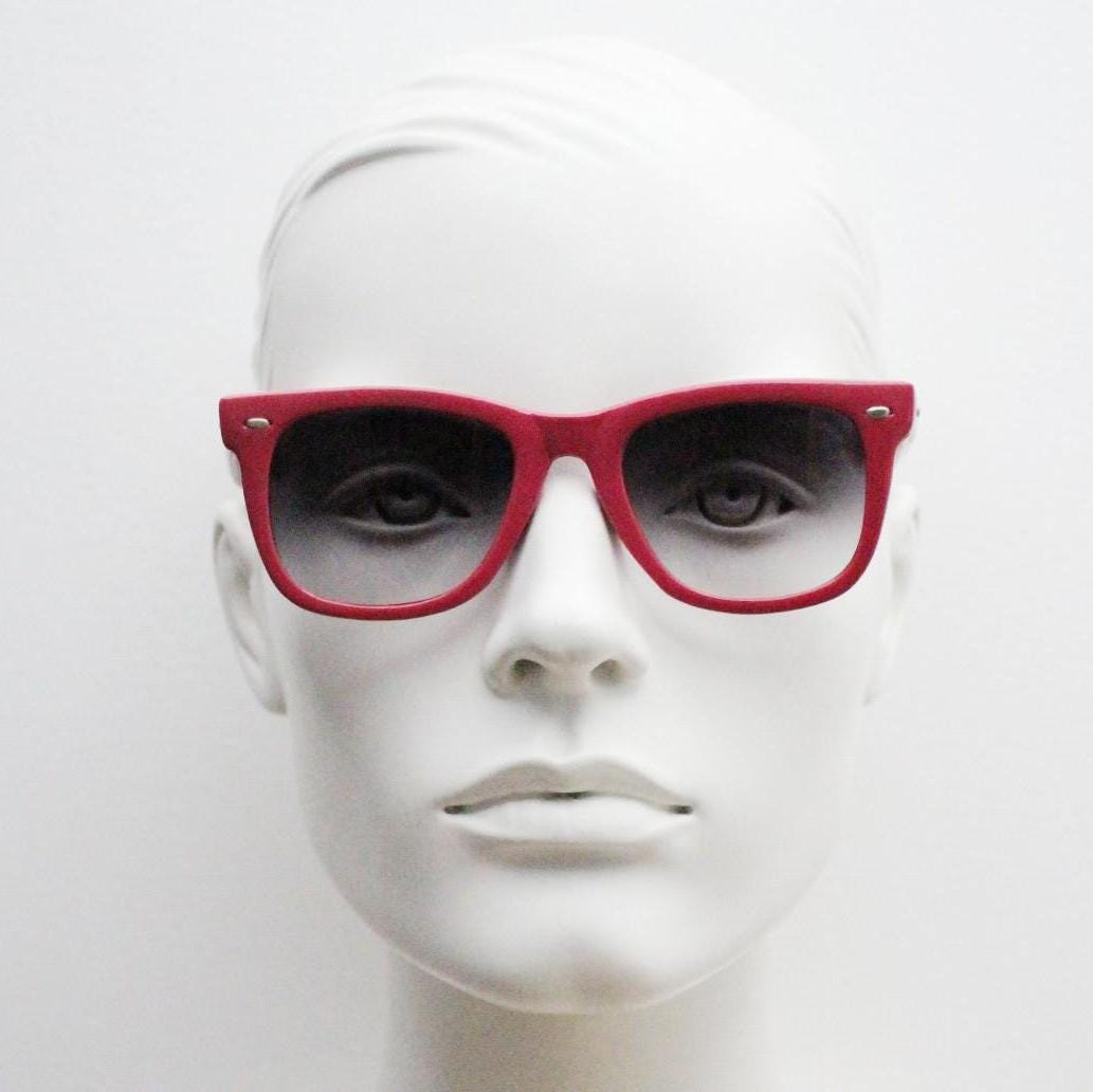 Vintage Y2K wayfarer design sunglasses. All time classic design in glossy pink with graduating smoky black lenses. Excellent NOS condition