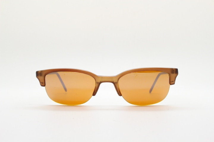 90s vintage low profile cat eye sunglasses. Transparent half frame cateye with matching mirror glazed light tone lenses. NOS