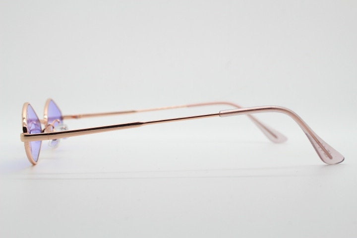 90s vintage small diamond sunglasses. Minimal gold psychedelic mod style frame with bright purple lenses. Unused New Old Stock
