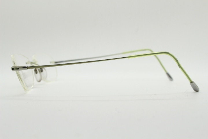 Silhouette rectangular frameless eye glasses made in Austria. Minimal lightweight optical frame with silver trim. Prescription RX