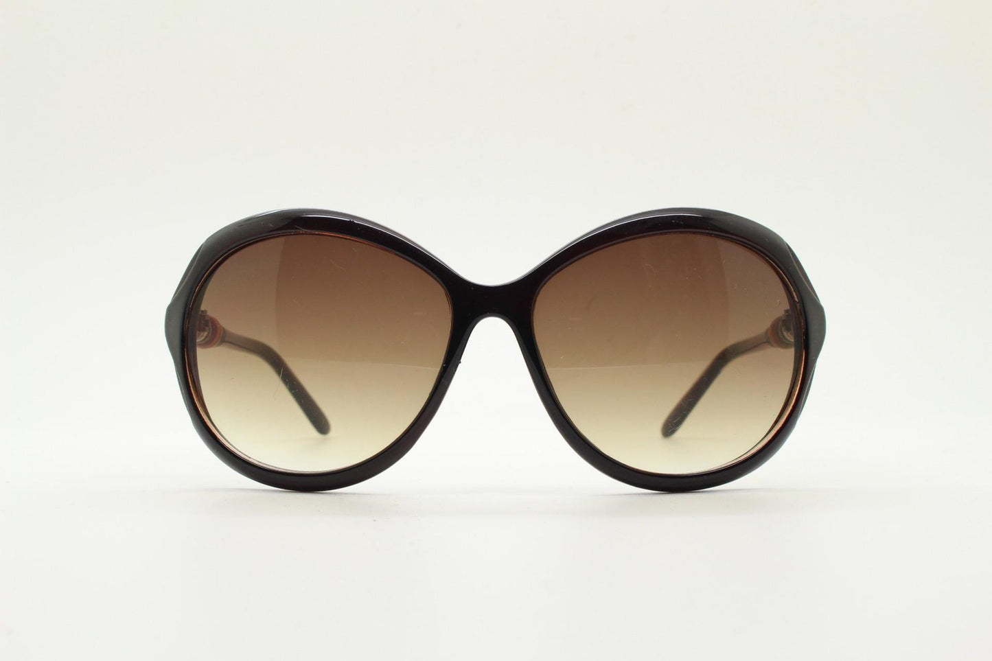 Y2K vintage big round sunglasses. Women's classical 60s design in brown gloss with graduating lenses and subtle arm detail. 2000s. 00s NOS